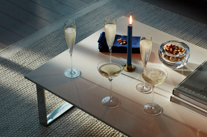 LSA | Savoy Collection glasses, featuring elegant, mouth-blown flutes with V-shaped sparkle points and chic coupes, ideal for enhancing celebrations with sparkling wines or cocktails.