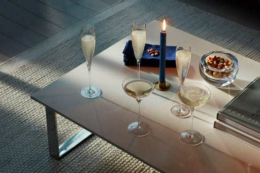LSA | Savoy Collection glasses, featuring elegant, mouth-blown flutes with V-shaped sparkle points and chic coupes, ideal for enhancing celebrations with sparkling wines or cocktails.