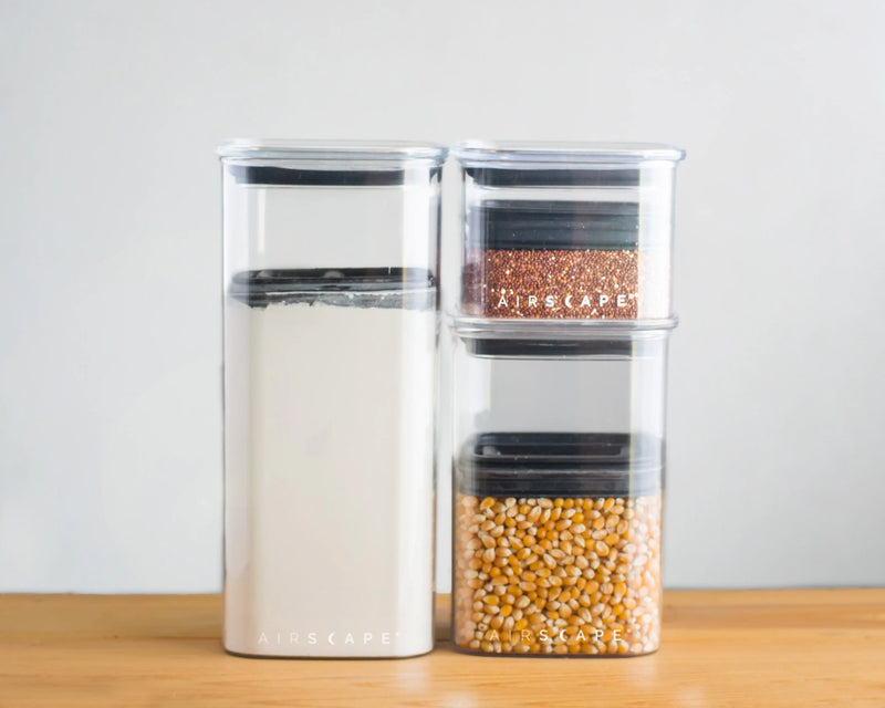 Set of 5 Airscape Lite Food Storage Canisters with patented valve system for freshness, suitable for organizing kitchen essentials like coffee and pasta.