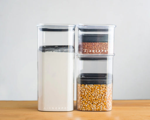 Set of 5 Airscape Lite Food Storage Canisters with patented valve system for freshness, suitable for organizing kitchen essentials like coffee and pasta.