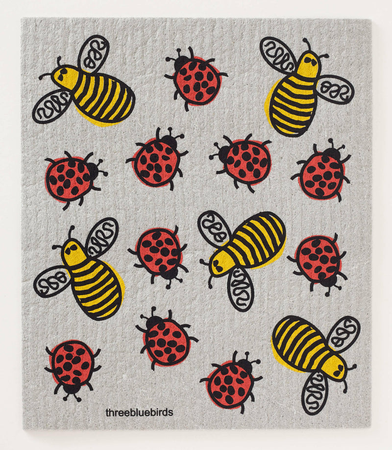 Three Bluebirds Swedish Dishcloth with whimsical ladybug and bee drawings, showcasing a sustainable, durable, biodegradable design. Ideal for eco-friendly kitchen tasks.