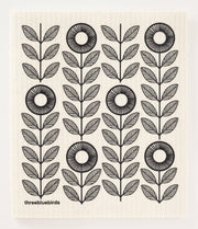 Three Bluebirds Swedish Dishcloths featuring a black and white floral and leaf motif, highlighting sustainable and stylish design for efficient cleaning.