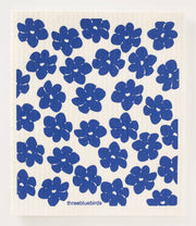 Three Bluebirds Swedish Dishcloths - Daffodils: Blue flower pattern on durable, biodegradable dishcloth, blending whimsy with functionality for eco-friendly cleaning.