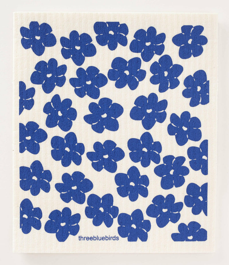 Three Bluebirds Swedish Dishcloths - Daffodils: Blue flower pattern on durable, biodegradable dishcloth, blending whimsy with functionality for eco-friendly cleaning.