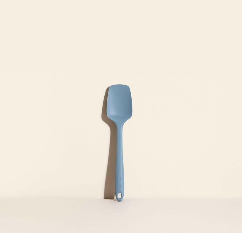 GIR | Ultimate Spoonula - Navy, a versatile kitchen tool combining a spoon and spatula, perfect for scraping, scooping, and serving, displayed on a white surface.