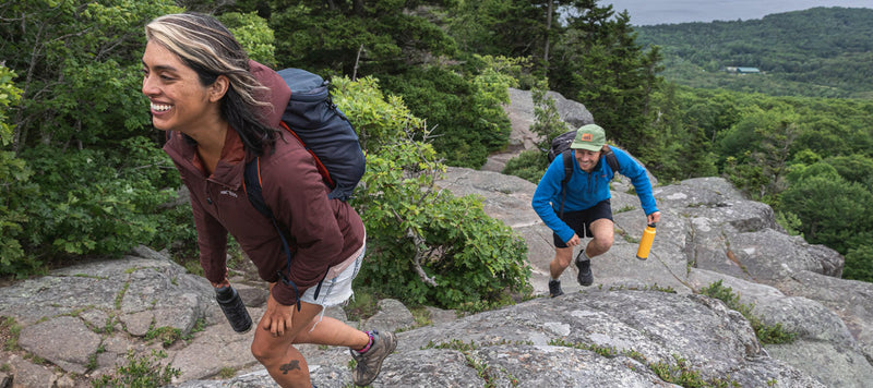Klean Kanteen 20oz Classic Insulated Water Bottle, ideal for outdoor adventures. Featured in use, highlighting its practicality for on-the-go hydration.