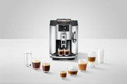 Jura E8 - Fully Automatic Espresso + Coffee Machine, showcasing its sleek design with a Professional Aroma Grinder and TFT display for versatile coffee brewing.