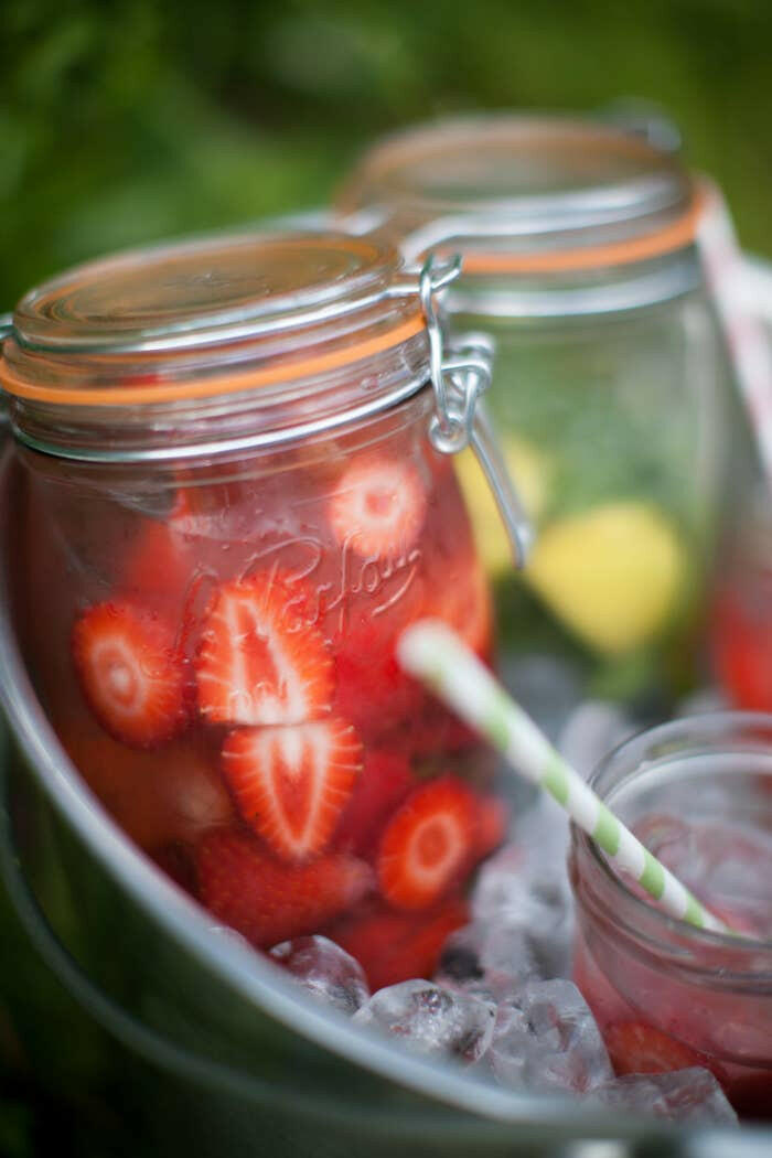 Le Parfait | Rounded French Glass Storage Jars - 3L filled with strawberries and mint-lemon mix, suggesting uses for fruit-infused waters or cold beverages.
