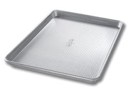 USA Pan | Sheet Pans - Half Sheet Pan designed for toaster ovens, featuring Americoat® nonstick silicone and a fluted design for enhanced baking performance.