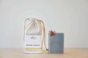 Bell Mountain | Bar Soaps - Solstice with a white bag, showcasing a natural, vegan soap option from Athens Cooks, enriched with botanical ingredients.