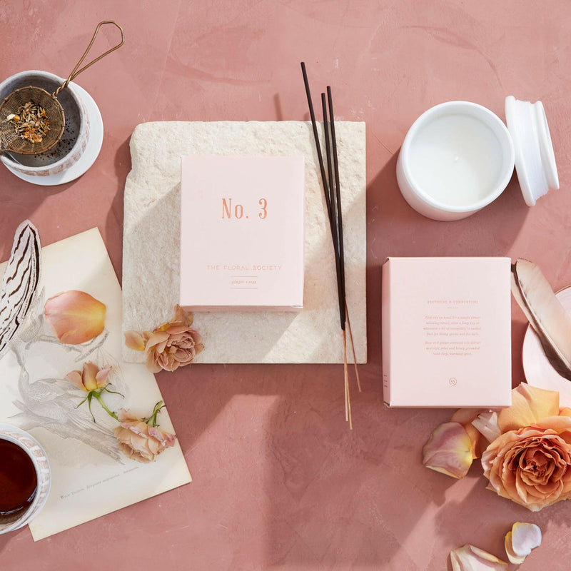 The Floral Society's Soy Wax Candle No. 3, Ginger + Rose, offers soothing aromas for living spaces or baths, enhancing tranquility with hand-poured elegance.