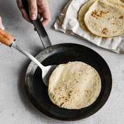 de Buyer | Mineral B Carbon Steel Crepe + Tortilla Pan - 10.25 shown, highlighting its natural carbon steel craftsmanship ideal for cooking crepes and tortillas, enhancing performance with use.